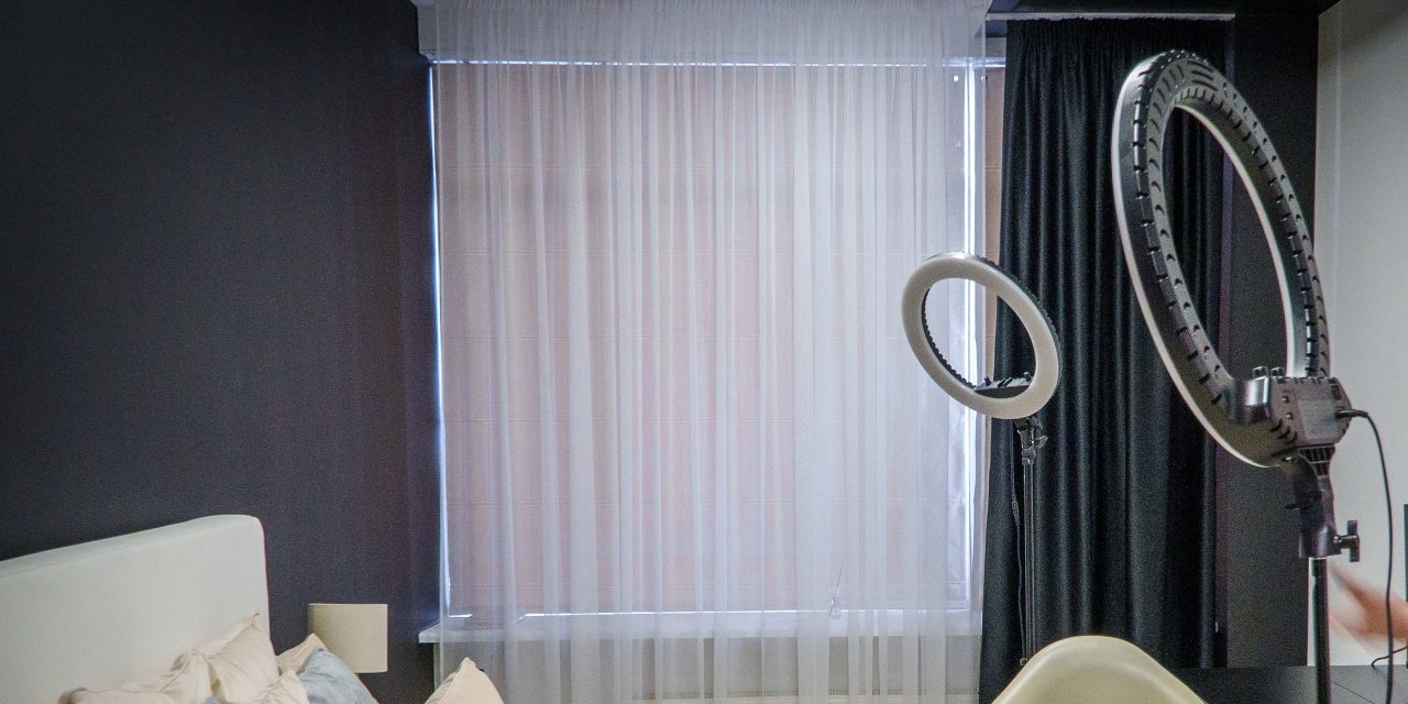 Bedroom With A Bed, Chair And a bedroom with a bed, chair and fan